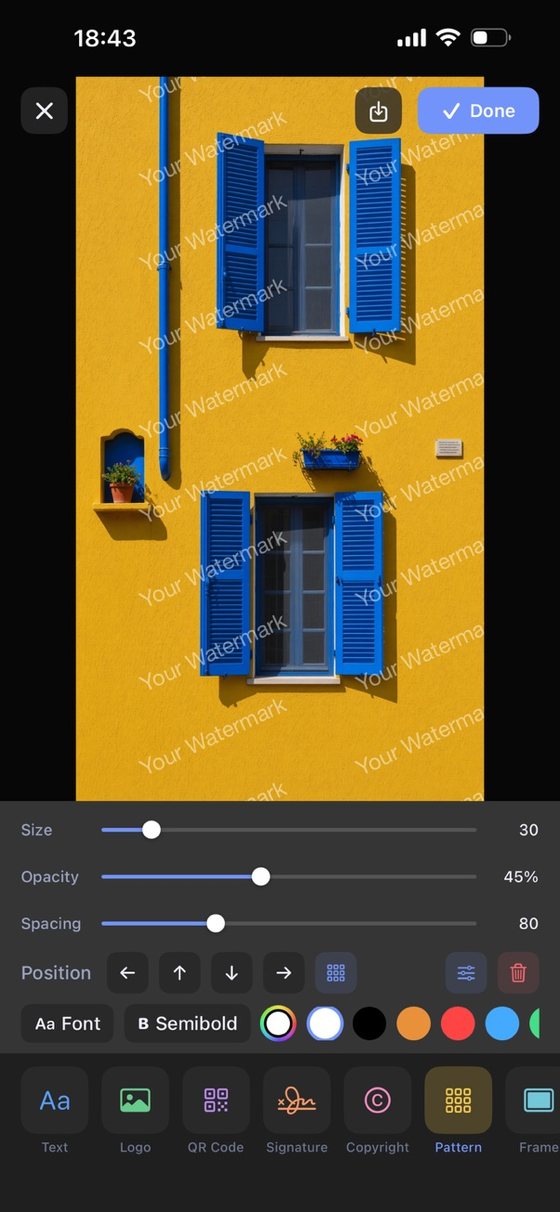 A repeating pattern watermark tiled across a photo in the editor